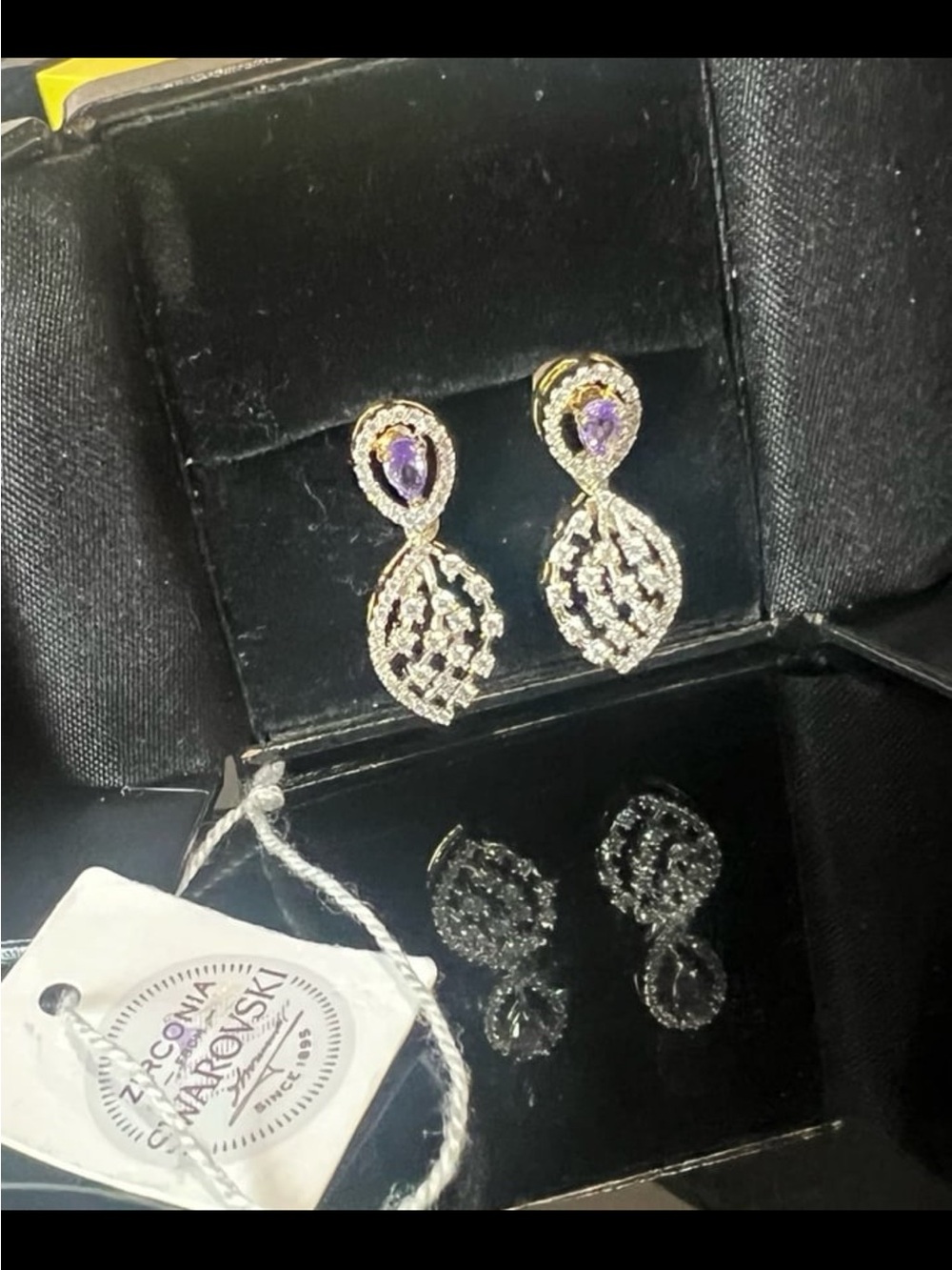 Gorgeous rhodium plated bridal earrings with amethyst crystal drops